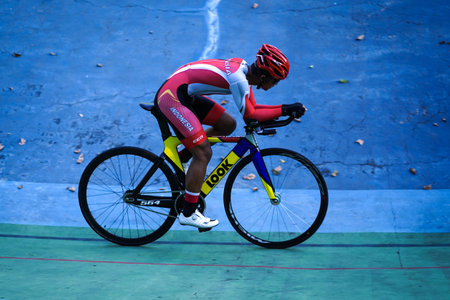Indonesian paracycling athlete Martin Losu is training to prepare for the next race at the Velodrome Manahan Solo. : Solo, Indonesia - 23 April 2021.のeditorial素材