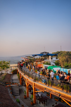 tourists enjoy the sunset at the tourist destination offering the best view in Yogyakarta, namely...