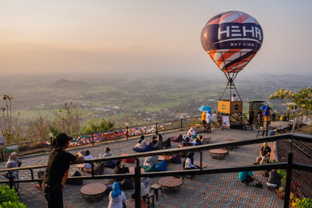 tourists enjoy the sunset at the tourist destination offering the best view in Yogyakarta, namely Heha Skyview. : Yogyakarta, Indonesia - 24 August 2023のeditorial素材