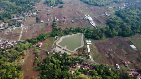 Aerial view of Imogiri 2 embung which has a shape like a Wayang mountain / kayonan, located in...