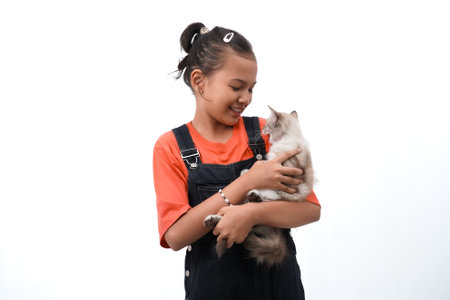 a little asian girl holding a kitten with love, cute. Isolated on white background. international cat day photo concept.の写真素材