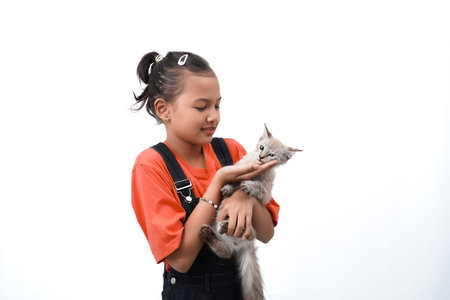 a little asian girl holding a kitten with love, cute. Isolated on white background. international...