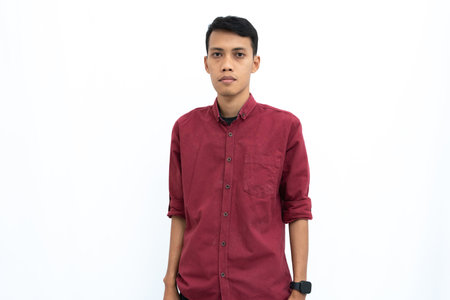 Asian man, businessman or student concept wearing red casual clothes, relaxed and cool pose. Isolated white background.の写真素材