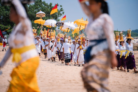 Bali, Indonesia - 08 March 2024: Thousands of participants walked in a procession celebrating melasti, a self-purification ceremony to welcome the Nyepi holiday by all Hindus in Bali.のeditorial素材