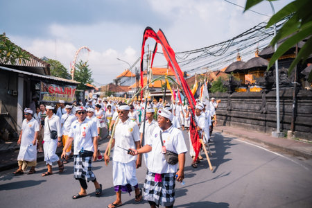 Bali, Indonesia - 08 March 2024: Thousands of participants walked in a procession celebrating melasti, a self-purification ceremony to welcome the Nyepi holiday by all Hindus in Bali.のeditorial素材
