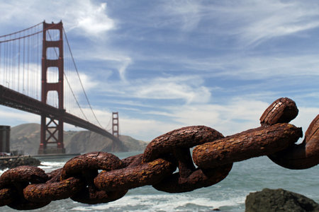 Rusty chain with Golden Gate bridge in the background