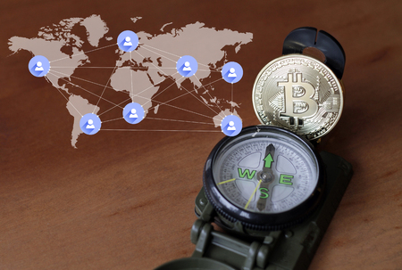 Exploring the crypto currency world - Compass and Bitcoinの写真素材