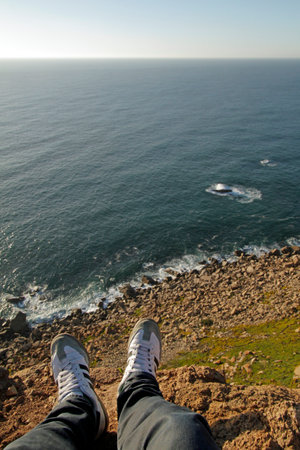 Cabo da Roca, Portugal - November 5, 2017: Sitting at the edge of Cabo da Roca (Cape Roca), west of Sintra - the westernmost point of continental Europe.のeditorial素材