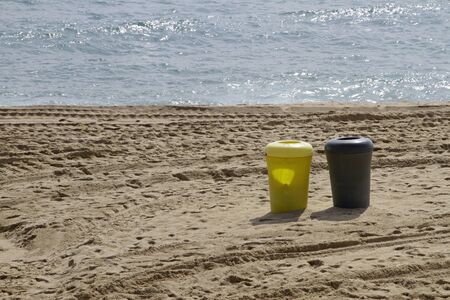 Ocean and trash cans - fighting plastic pollutionの写真素材