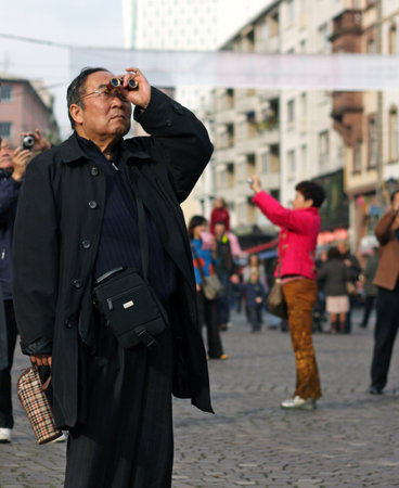 Frankfurt, Germany - July 13, 2019: A travel group of Chinese tourists have a look around the old town of Frankfurt, Germany.のeditorial素材