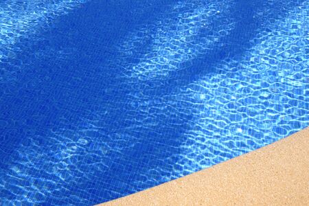 Ripples on the surface of an outdoor pool on a sunny dayの写真素材