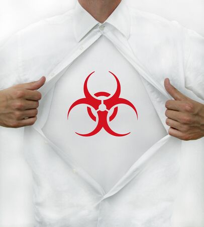 Corona virus test: man opens shirt to reveal bio hazard symbolの写真素材