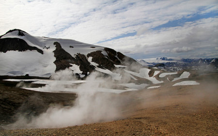 Rugged mountain range and snow-covered areas in Icelandの写真素材