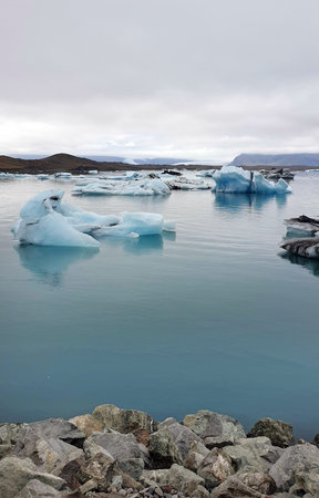 Jokulsarlon Glacier Lagoon in Iceland with icebergs and clear water