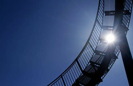 Steep metal stairs with curvesの写真素材