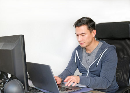 Video call: a man working from home at a desk