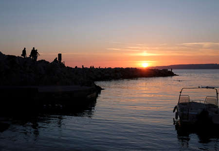 Boats on the coast of Marseille, France, during sunsetの写真素材