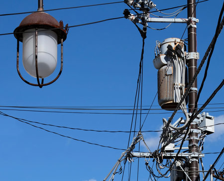 <p>Power lines in Japan against the blue sky</p>の写真素材