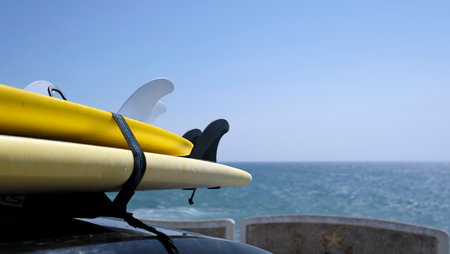 Surfboards loaded onto a car near the coast of Ericeira, Portugalの写真素材