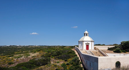 White chapel under a blue sky in Portugalの写真素材