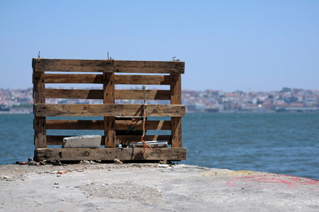 Lisbon harbor view with wooden pallet on a pierの写真素材