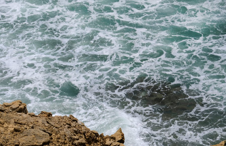 Looking down at the waves arriving at the coast of Ericeira, Portugal