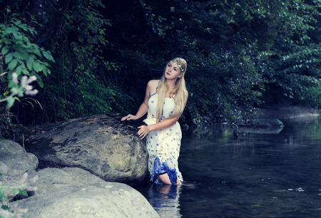 beautiful girl in the riverの写真素材