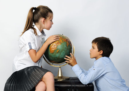 children with old globeの写真素材