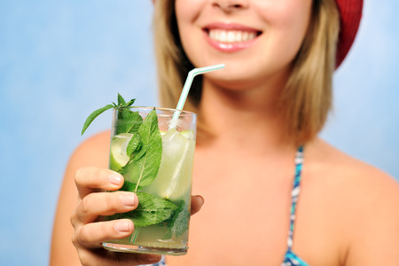 smiling girl with mojitoの写真素材