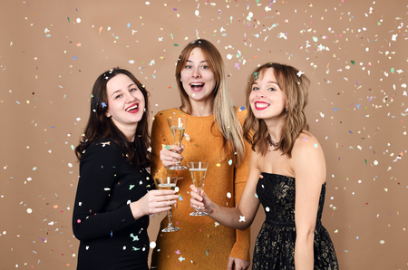 pretty happy girls with glasses of champagneの写真素材