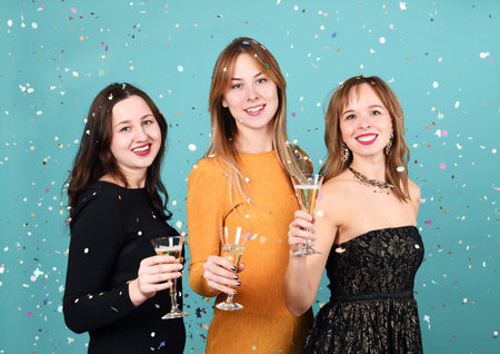 pretty happy girls with glasses of champagne