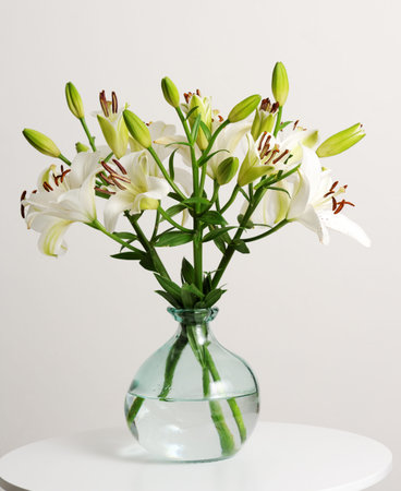 vase with beautiful white liliesの写真素材