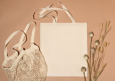 Beige cotton tote bags with died plants for mock upの写真素材