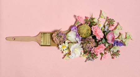 Brush with beautiful bouquet on pink backgroundの写真素材
