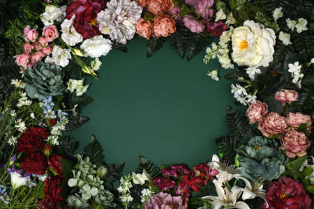 Frame of beautiful flowers on green backgroundの写真素材