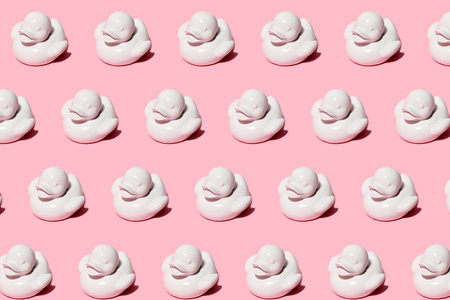 Pattern of white ducks on pink backgroundの写真素材
