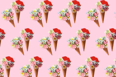 Pattern of floral ice cream cones on pink backgroundの写真素材