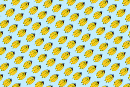 Pattern of bananas on light blue backgroundの写真素材