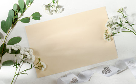 Beautiful arrangement of empty card, leaves and flowers