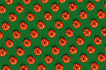 Pattern of tomatoes on green backgroundの写真素材