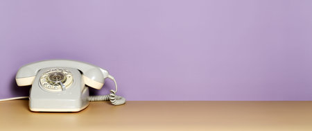 Vintage telephone on a violet background