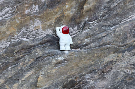 Funny spaceman explore the rocksの写真素材