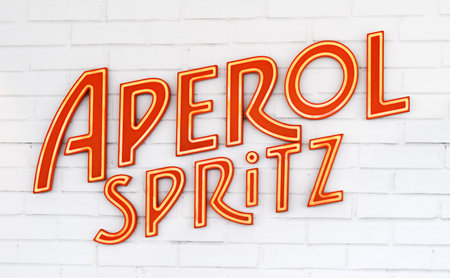 Kiel, Germany, 29 June 2023. Aperol spritz logo on a white brick wall of barのeditorial素材