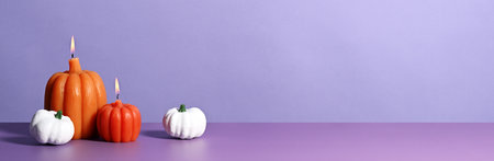 Decorative pumpkins on violet backgroundの写真素材