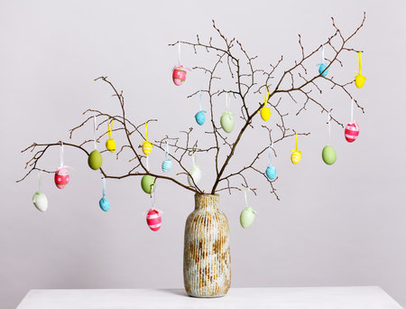 Vase with brahches and Easter eggsの写真素材
