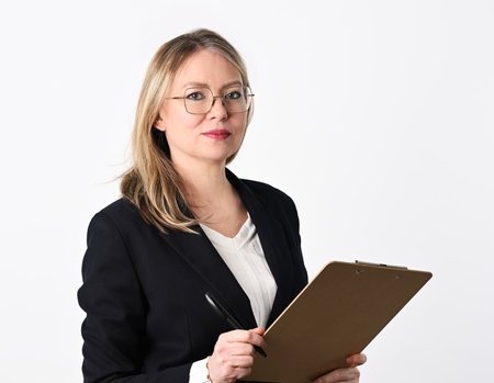 Portrait of cheerful businesswoman on white backgroundの写真素材