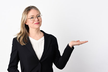 Portrait of cheerful businesswoman on white backgroundの写真素材