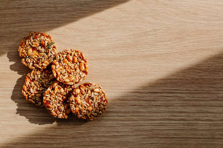 Kozinak cookies made from seeds and nuts on a wooden background. Flat lay, top view, copy space. High quality photoの写真素材