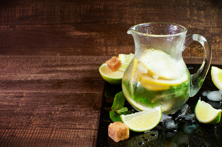 Pitcher with fresh fruit tonic water. With lemon, lime and mint.の写真素材