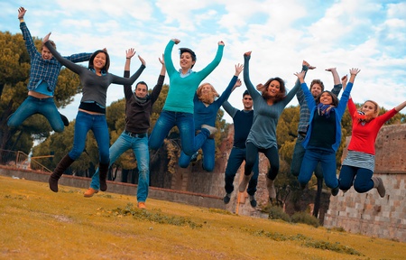 Group of People Jumping in the park の写真素材
